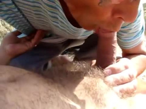 Old Man Blows Friend on Beach